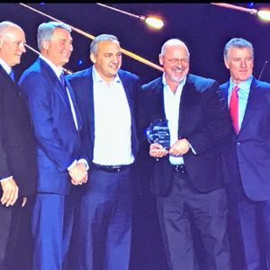 United Pipe's Noah Heller and Michael Blair on stage with the WinSupply senior management team